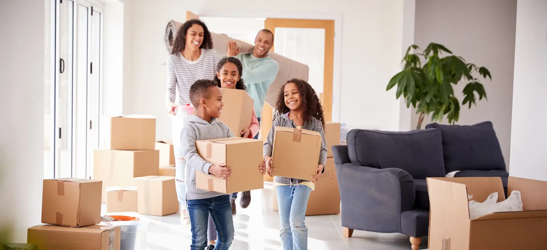 Happy family moving in to their new home thanks to Snap Mortgage, LLC